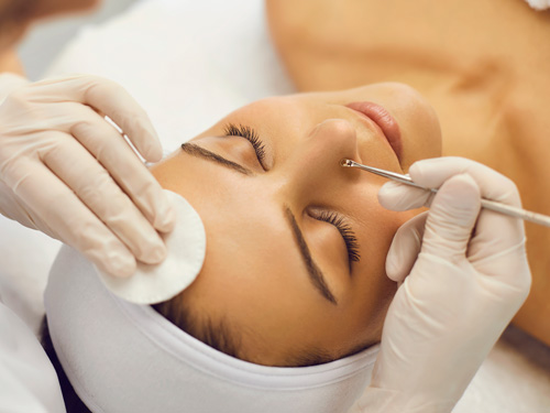 Woman enjoying the process of blocked pore extraction in Oklahoma City