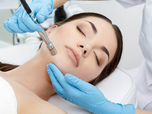 Woman undergoing Microdermabrasion Treatment in Oklahoma City at RMAOK