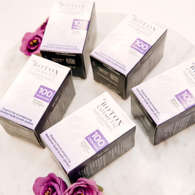Five boxes of Botox products are placed on a table for an aesthetic treatment in Oklahoma City