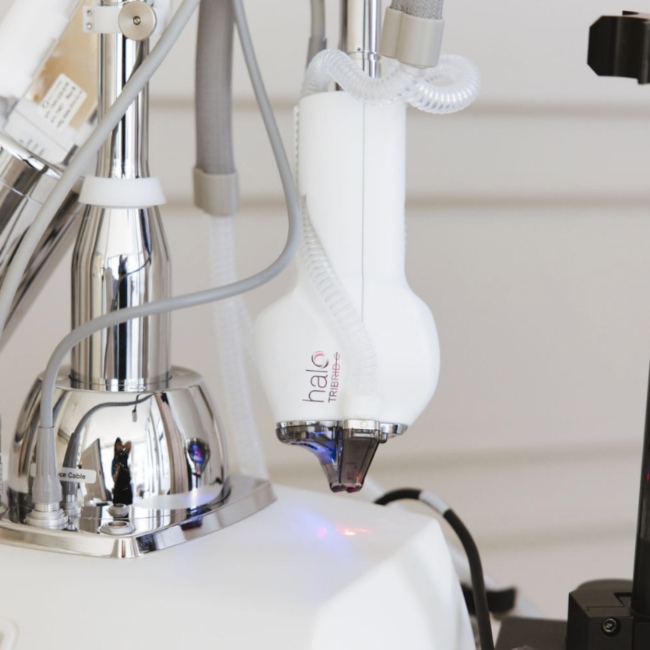A white laser treatment machine set up for a cosmetic skin treatment at a med spa in Oklahoma City