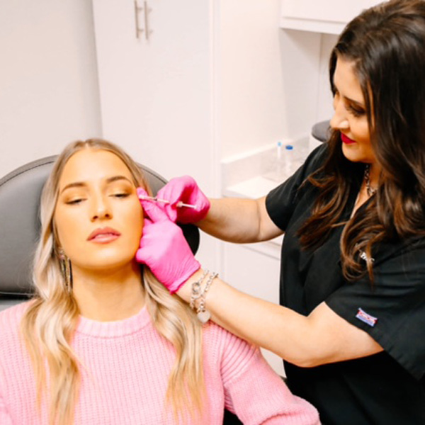 Woman receiving dermaplaning treatment at OKC Med Spa