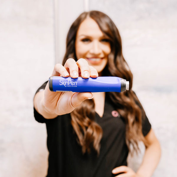 woman holding SkinPen device