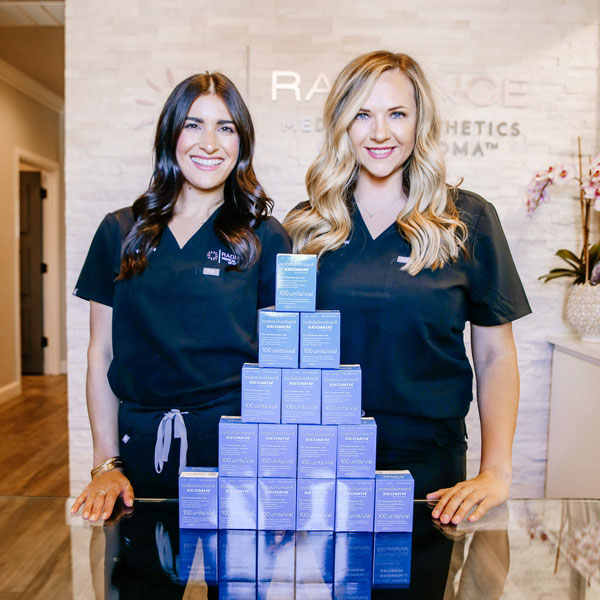 staff standing by boxes of Xeomin