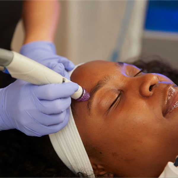 Woman receiving DiamondGlow Treatment at RMAOK in Oklahoma